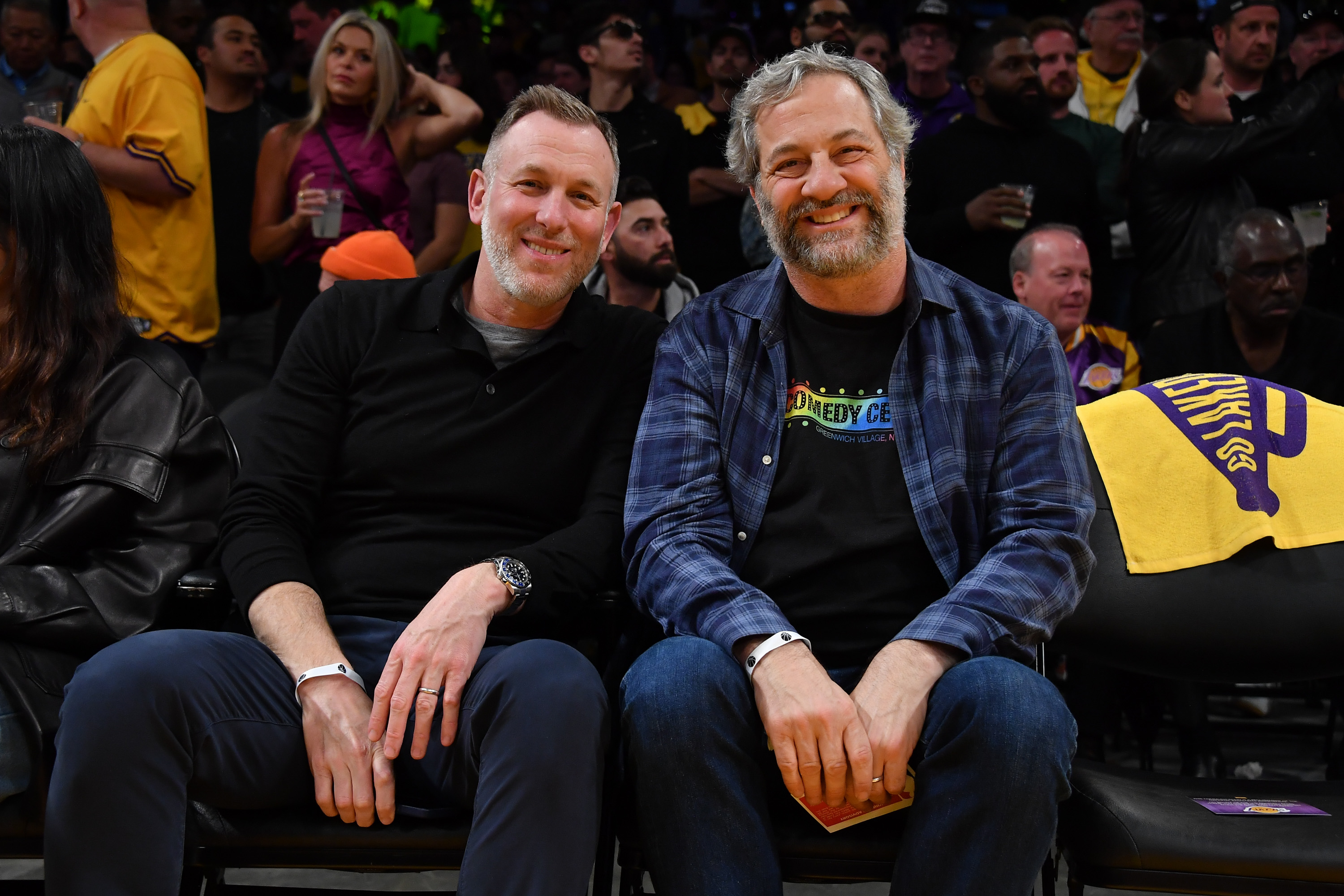 Judd Apatow (R) attends a playoff basketball game between the Los Angeles Lakers and the Golden State Warriors.