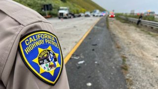 CHP officers at the scene of a crash on the 101 Freeway.
