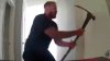 Watch: Man Who Crashed Into Home Breaks Down Door With Pick-Axe