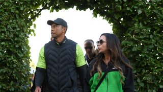 Tiger Woods of USA and his girlfiend Erica Herman leave the 18th green after day one of the JP McManus Pro-Am at Adare Manor Golf Club in Adare, Limerick.