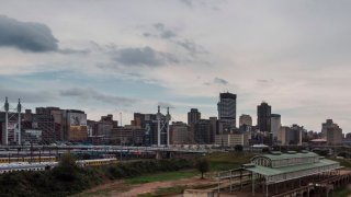 This aerial view shot in Johannesburg, on March 29, 2020 shows the city skyline with the old train station (R), Mandela bridge in Braamfontein and the Park Station train depot.