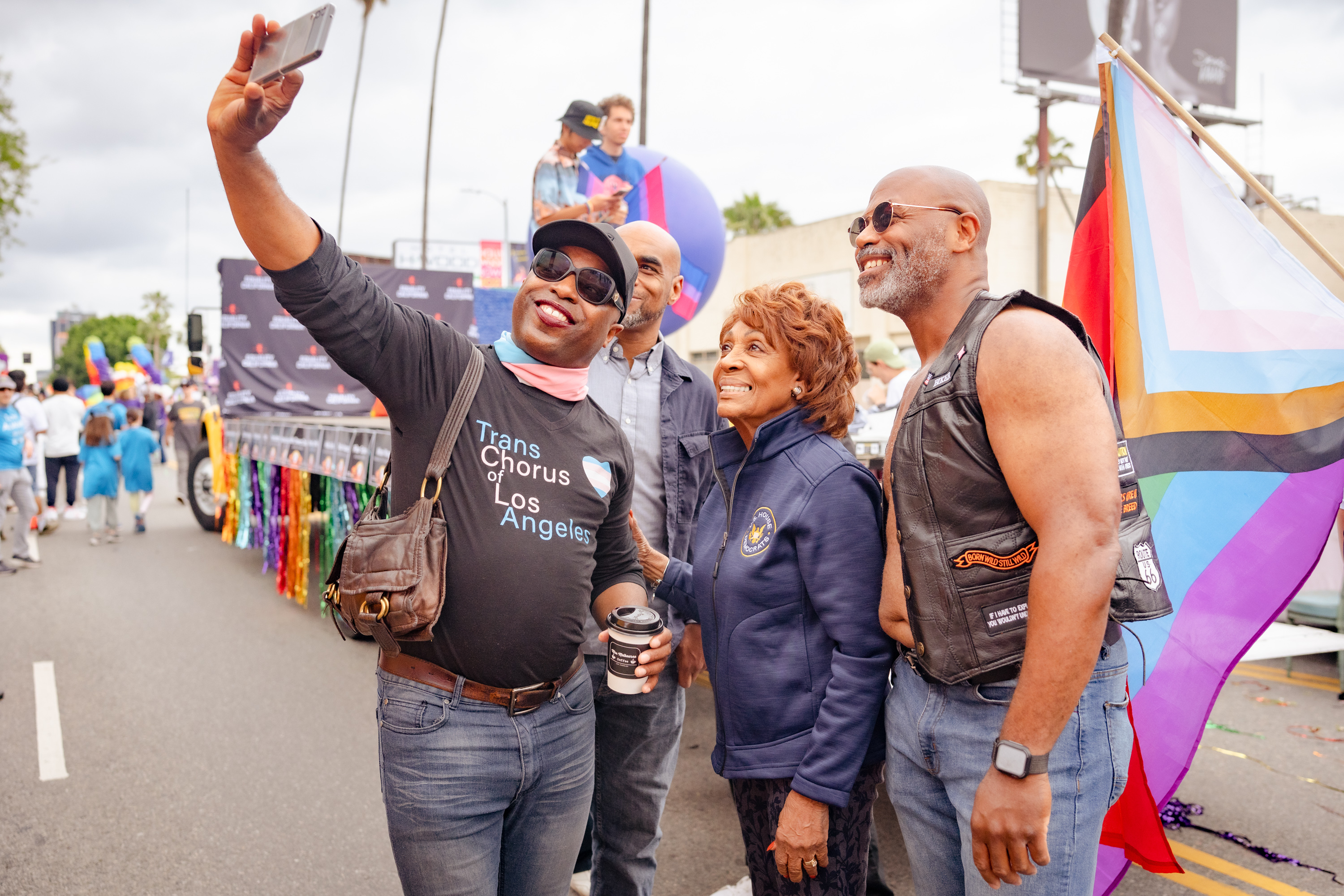 Representative Maxine Waters, a Democrat from California, center, takes a selfie photograph with attendees during the LA Pride Parade in Los Angeles, California, US, on Sunday, June 11, 2023. Comedian Margaret Cho serves as a grand marshal of the LA Pride Parade as the annual procession returns for its 53rd year. Photographer: Morgan Lieberman/Bloomberg via Getty Images