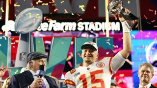 Patrick Mahomes hoists the Lombardi Trophy following the Chiefs' Super Bowl LVII victory.