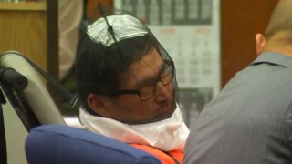 Anthony Rauda appears in court Wednesday June 7, 2023 in a restraint chair and wearing a spit hood over his head.
