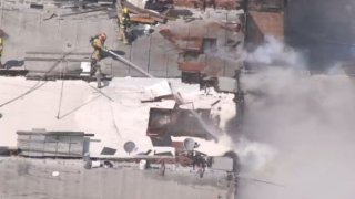 Firefighters battled a commercial building fire Thursday June 22, 2023 in downtown Los Angeles.