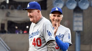 Former Dodgers Roger Craig (left) and Sandy Koufax walk off the field after the ceremonial first pitch before the game between the Colorado Rockies and the Los Angeles Dodgers at Dodger Stadium on May 16, 2015 in Los Angeles, California. (Photo by Lisa Blumenfeld/Getty Images)