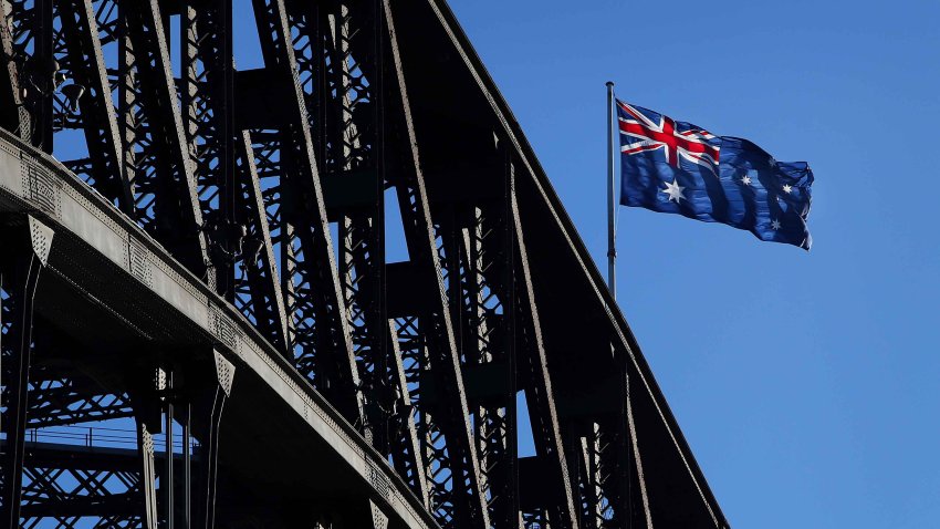 The Australia flag atop the Sydney Harbour Bridge in Sydney, Australia, on Monday, May 8, 2023.