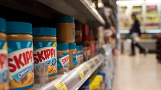 Bottles of American Peanut butter brand, Skippy, are displayed for sale at a supermarket in Hong Kong. As United State president Donald Trump signed the bill to increase the trade tariff against Chinese imported product entering the USA. China is responding by increasing trade tariff of American product imported to China.