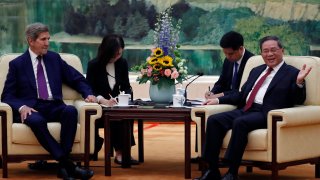 U.S. Climate Envoy John Kerry and China’s Premier Li Qiang attend a meeting at the Great Hall of the People in Beijing on July 18, 2023.