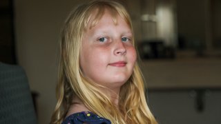 Flower Nichols, an 11-year-old transgender girl, poses for a portrait in Chicago on June 13, 2023. Families around the U.S. are scrambling to navigate new laws that prohibit their transgender children from accessing gender-affirming care. At least 20 states are moving to ban or restrict such care for minors. (AP Photo/Teresa Crawford)