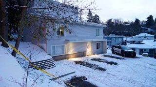 Bare spots are seen, Nov. 29, 2022, in the snowy parking lot in front of the home where four University of Idaho students were found dead on Nov. 13, in Moscow, Idaho.