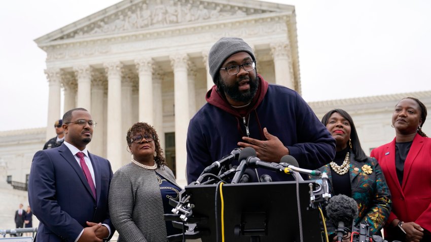 FILE – Evan Milligan, center, plaintiff in Merrill v. Milligan, an Alabama redistricting case that could have far-reaching effects on minority voting power across the United States, speaks with reporters following oral arguments at the Supreme Court in Washington, Oct. 4, 2022. Alabama lawmakers convene Monday, July 17, 2023 to draw a new congressional map. The directive comes after the U.S. Supreme Court ruling that affirmed the lower court’s ruling that Alabama’s existing congressional map — with a single Black district —  likely violated the Voting Rights Act. (AP Photo/Patrick Semansky, File)