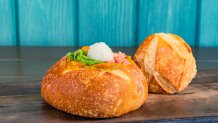 Curry Beef (Aunt Cass Café) – Beef, carrots, potatoes, and onions cooked in classic curry topped with rice, pickled ginger, and green onions served in a Boudin sourdough bread bowl. Available later in summer 2023. For more details, visit DisneyParksBlog.com. (David Nguyen/Disneyland Resort)
