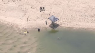 Deputies at the scene of a body discovered in a barrel in Malibu Monday July 31, 2023.