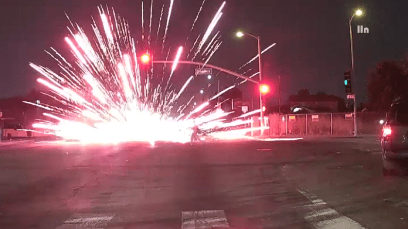 A group of young people were seen running away from the scene after they threw the illegal fireworks on the street, setting dry vegetation in the corner on fire.