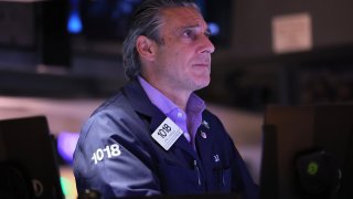 Traders work on the floor of the New York Stock Exchange during afternoon trading on July 18, 2023 in New York City.