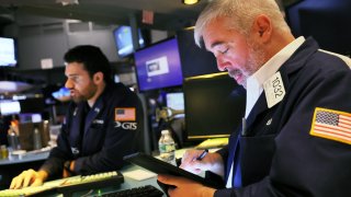 Traders work on the floor of the New York Stock Exchange on August 16, 2023 in New York City.