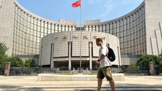 A man walks past the People’s Bank of China (PBOC) building on July 20, 2023 in Beijing, China. (Photo by Jiang Qiming/China News Service/VCG via Getty Images