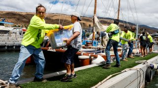 Supplies for Lahaina fire victims are gathered and delivered by Hawaiians sailing on a large catamaran who often sail around the world together to Lahaina neighborhoods.