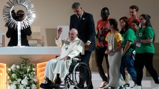 Pope Francis waves to the crowd during the 37th World Youth Day