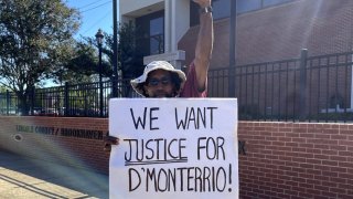 Rayshun Bridges demonstrates outside the Lincoln County Courthouse in Brookhaven, Miss., on Thursday, Aug. 17, 2023, after a judge declared a mistrial for two white men charged in a 2022 attack on D'Monterrio Gibson, a Black employee of FedEx.