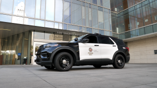 An LAPD black and white patrol car is seen parked in the courtyard in front of Department headquarters in Downtown LA.