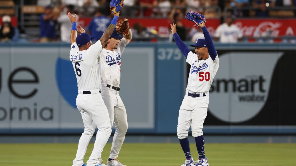 Mookie Betts and David Peralta of the Los Angeles Dodgers celebrate News  Photo - Getty Images