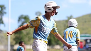 Louis Lappe #19 of the West Region team from El Segundo, California reacts after scoring a run.
