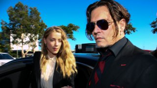 Johnny Depp (R) and his then-wife Amber Heard