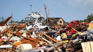 Debris covers a residential area in Perryton, Texas, Thursday, June 15, 2023, after a tornado struck the town.