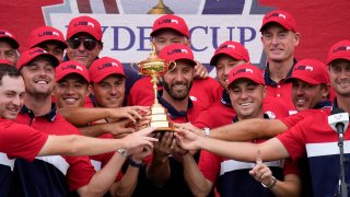 FILE – Team USA players and captains pose with the trophy after the Ryder Cup matches at the Whistling Straits Golf Course Sunday, Sept. 26, 2021, in Sheboygan, Wis. The Americans will try to win for the second straight time outside Rome when the matches start Friday, Sept. 29.