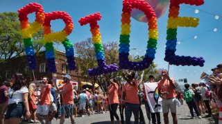 FILE – Participants take part in the annual LA Pride Parade in West Hollywood, Calif., Sunday, June 9, 2019. California Gov. Gavin Newsom signed several bills Saturday, Sept. 23, 2023, aimed at bolstering the state’s protections for LGBTQ+ people, despite a controversial veto the day before that was criticized by advocates. (AP Photo/Richard Vogel, File)