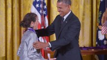 US President Barack Obama presents the National Medal of Arts to Julia Alvarez, novelist, poet, and essayist, during a ceremony in the East Room of the White House on July 28, 2014 in Washington, DC. AFP PHOTO/Mandel NGAN (Photo credit should read MANDEL NGAN/AFP via Getty Images)