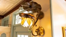 Guests will find lily pad light fixtures inside Tiana’s Palace, which will open in New Orleans Square at Disneyland Park in Anaheim, Calif., on Sept. 7, 2023. Inspired by the Walt Disney Animation Studios film “The Princess and the Frog,” the reimagined quick service restaurant will serve authentic New Orleans flavors inspired by Tiana’s friends and adventures. While Tiana’s Palace is not a character dining location, guests may find Tiana in New Orleans Square. (Christian Thompson/Disneyland Resort)