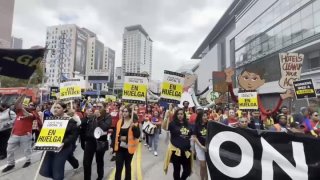 Hotel union workers march through downtown Los Angeles.