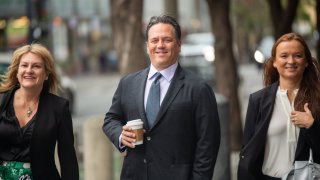 Phil Spencer, chief executive officer of gaming at Microsoft Corp., center, arrives to court in San Francisco on June 28, 2023.