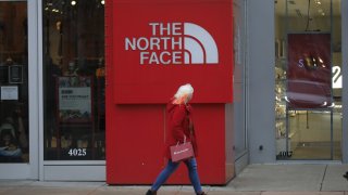 A shopper passes in front of a North Face store at the Easton Town Center mall in Columbus, Ohio, on Jan. 7, 2021.