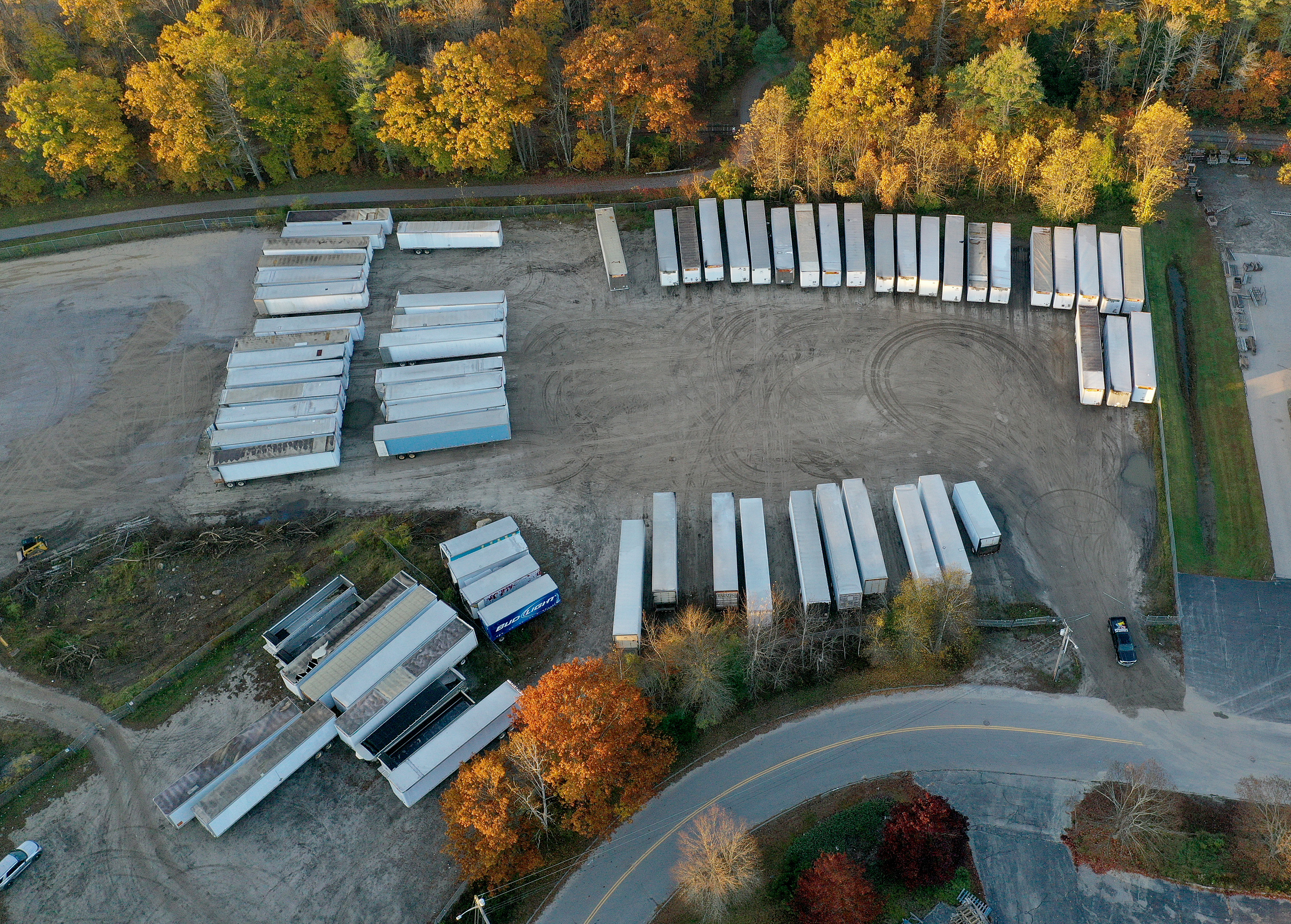 LISBON, MAINE – OCTOBER 28:  In an aerial view, police vehicles are seen in the area near the Maine Recycling Center building where Robert Card, the suspect in two mass killings, was found dead on October 28, 2023 in Lisbon, Maine. Mr. Card, who had worked at the recycling center, allegedly killed 18 people in a mass shooting at a bowling alley and restaurant in Lewiston.  (Photo by Joe Raedle/Getty Images)