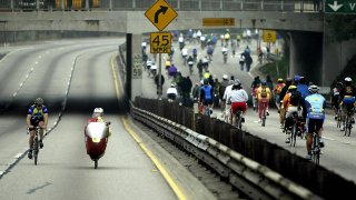 Hundreds of cyclists ride the 110 Pasadena Freeway, the oldest on the US west coast, during the Arroyo Fest, a festival of the Arroyo Seco Community, in Pasadena, California, 15 June 2003.