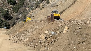 Crews work on a section of Angeles Crest Highway in October 2023.
