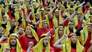 Supporters of Lebanon’s Hezbollah party parade to mark the last day of Ashura ceremony in Beirut.