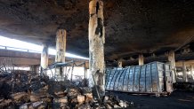 Fire damage is viewed beneath the 10 Freeway.