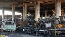 Fire damage is viewed beneath the 10 Freeway.