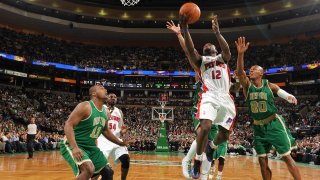 Will Bynum of the Detroit Pistons shoots a layup against Ray Allen and Glen Davis of the Boston Celtics during the game at The TD Garden on March 15, 2010, in Boston.