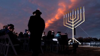 A man returns to his seat during the National Chanukah Menorah lighting, Thursday, Dec. 7, 2023, on the Ellipse near the White House in Washington.
