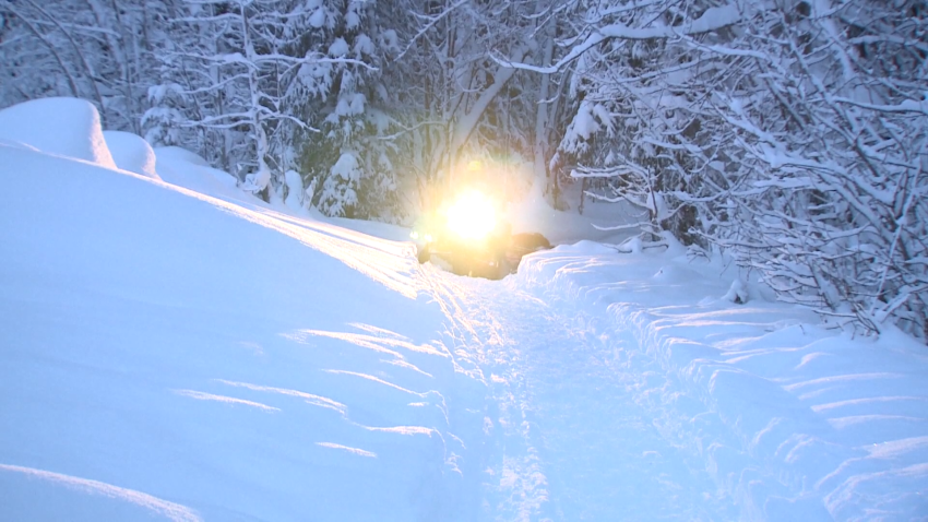 Snow truck searching for missing woman in Alaska.