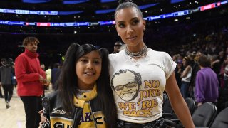 File - Kim Kardashian and daughter North West attend the Western Conference Semifinal Playoff game