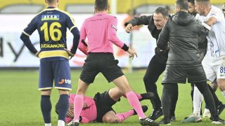 Referee Halil Umut Meler falls to the ground after Faruk Koca, President of MKE Ankaragucu throws a punch to him.