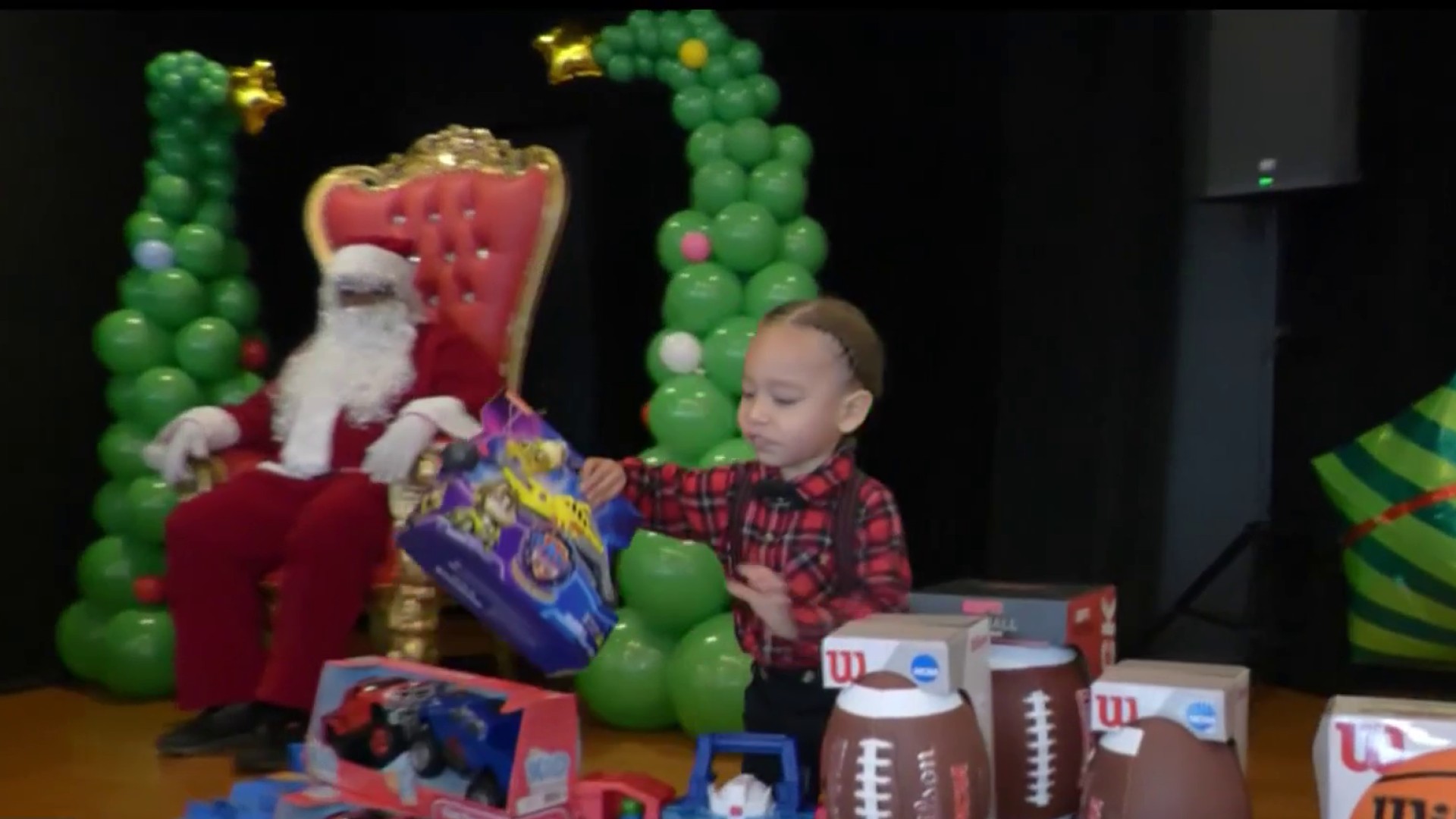 Santa surprises over 50 kids with gifts in San Pedro