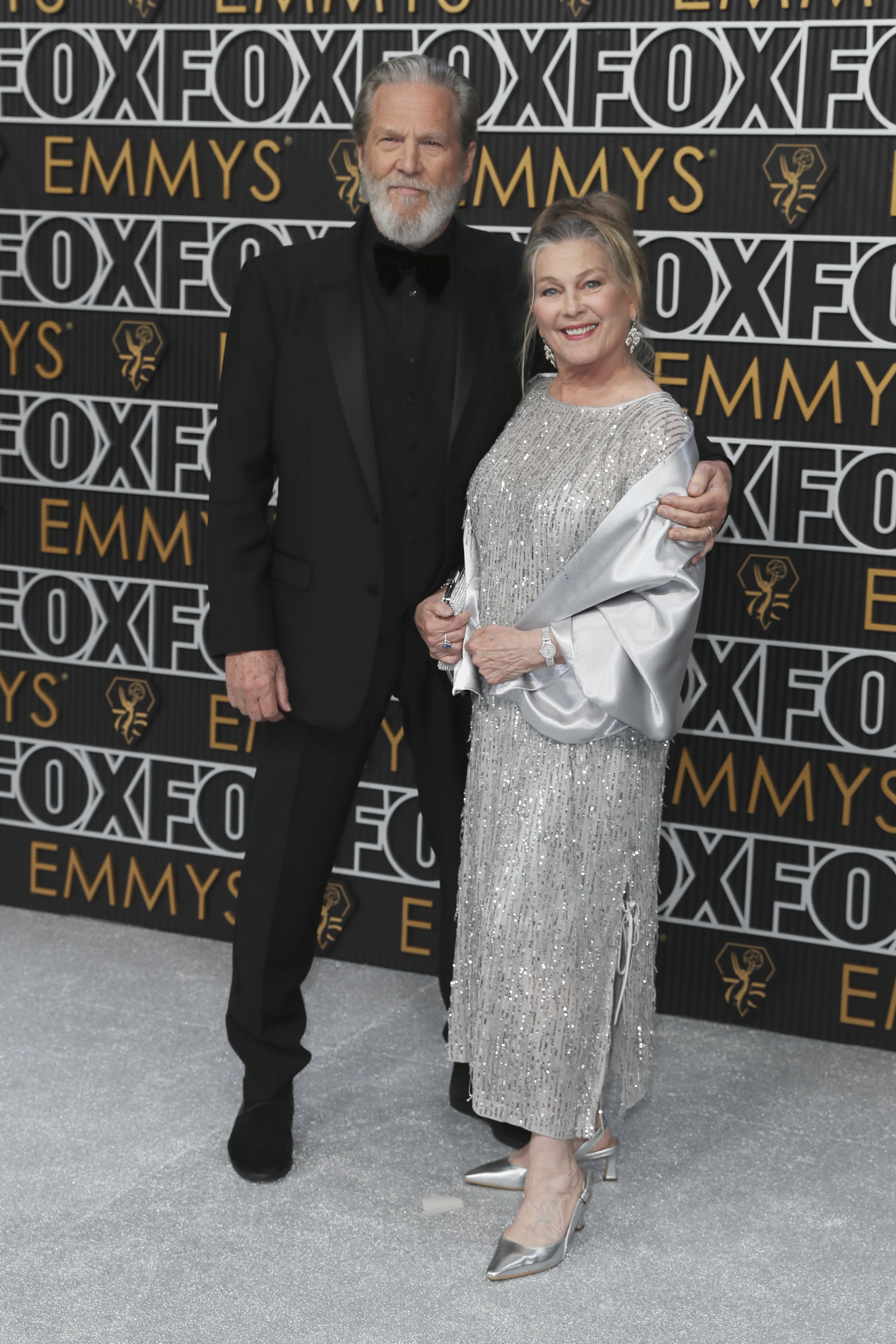 Jeff Bridges, left, and Susan Geston pose for a Red Carpet portrait at the 75th Emmy Awards on Monday, Jan. 15, 2024 at the Peacock Theater in Los Angeles. (Photo by Danny Moloshok/Invision for the Television Academy/AP Images)